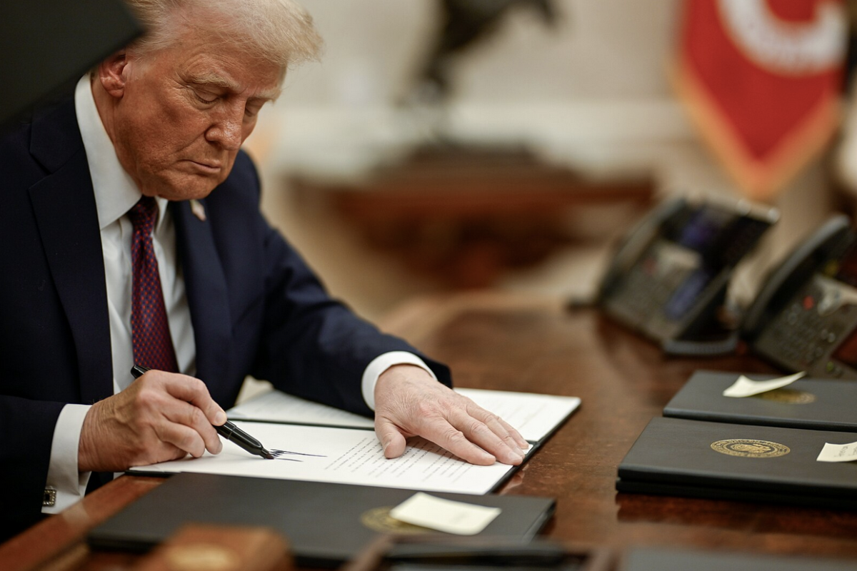 Trump signing executive orders on January 20, 2025 - Image credit The White House
