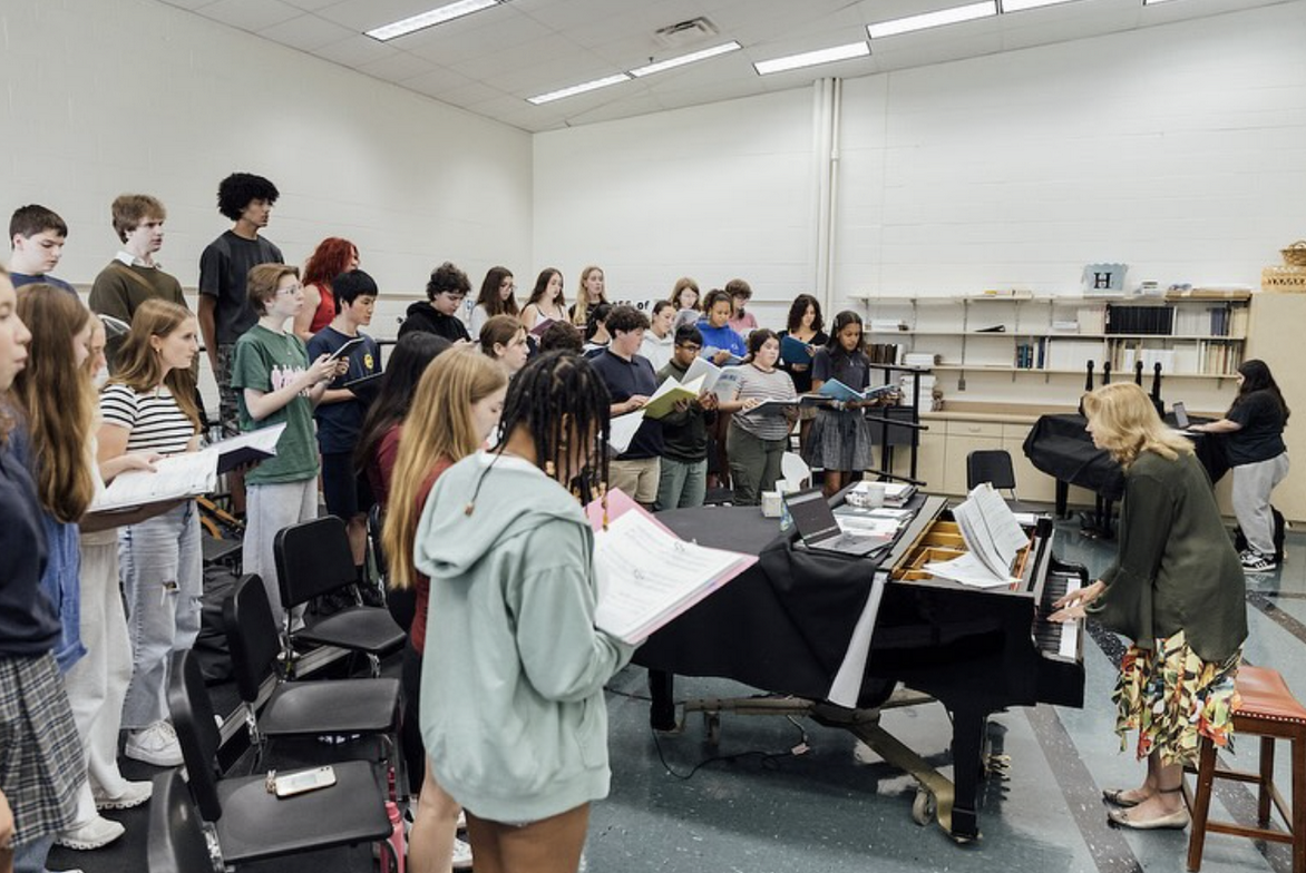 The Mamma Mia! cast practicing music for the show. 
