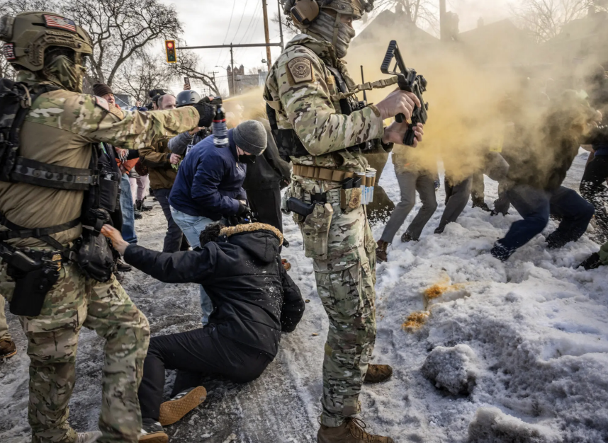 Masked federal agents clash with protesters after the shooting of Renee Good in Minneapolis. Image from The New York Times.