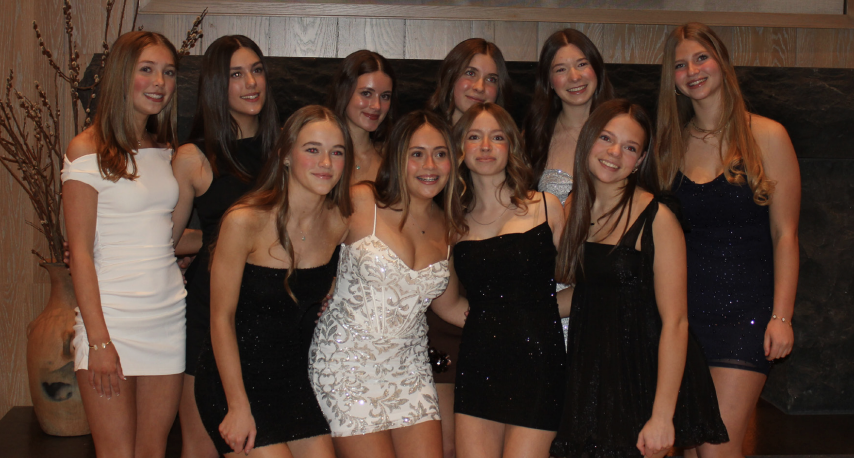 A group of freshman take photos before the 2026 Snow Days dance. Image credit Talia Kramer. 